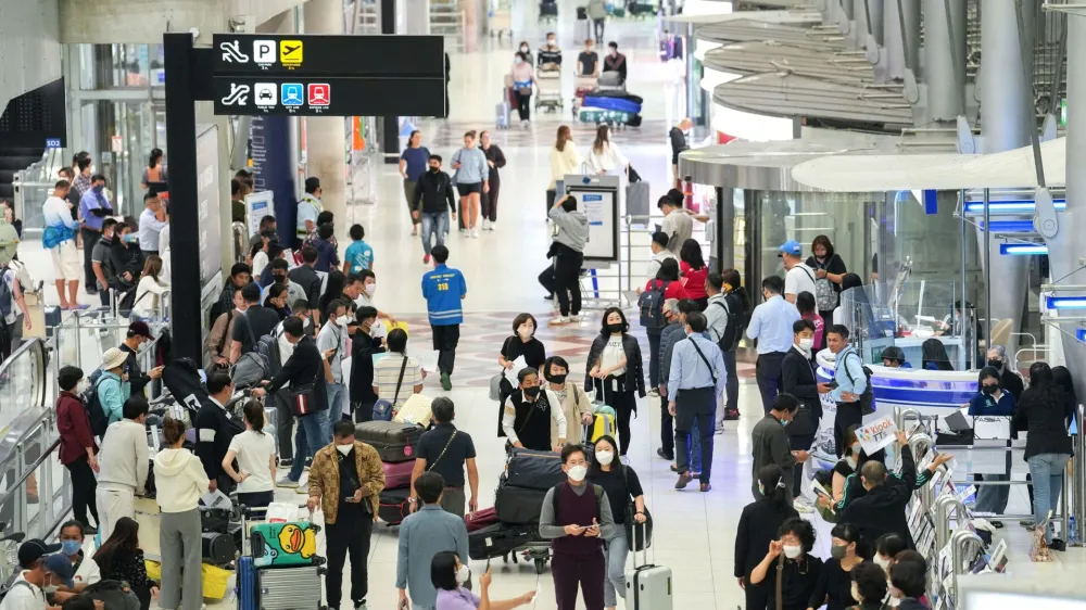 Tourists arrive, ahead of brace of an influx of Chinese tourists as COVID restriction are dismantled, at Bangkok's Suvarnabhumi airport, Thailand, January 4, 2023. REUTERS/Athit Perawongmetha