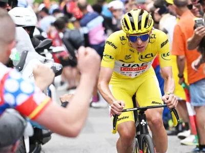 13 July 2024, France, Saint-Lary-Soulan Pla D'adet: Slovenian Tadej Pogacar of UAE Team Emirates on his way to win stage 14 of the 2024 Tour de France cycling race, from Pau to Saint-Lary-Soulan Pla d'Adet. Photo: Pool Bernard Papon/Belga/dpa