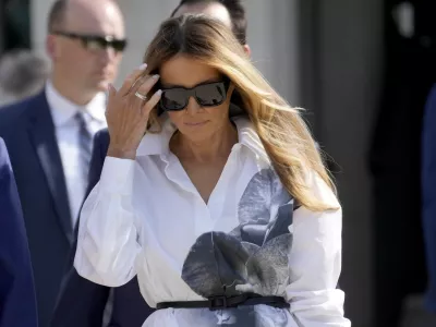 FILE - Former first lady Melania Trump leaves after voting in the Florida primary election in Palm Beach, Fla., March 19, 2024. Melania Trump is not expected to speak at next week's Republican National Convention, which will feature speeches by other Trump family members and a long list of GOP officials. The former first lady will attend the convention, but does not appear on a list of  headliners and keynote speakers released by convention organizers Saturday, July 13. (AP Photo/Wilfredo Lee, File)