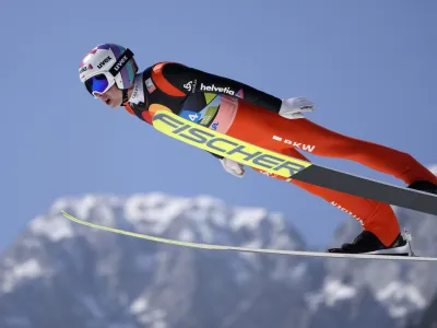 Simon Ammann, of Switzerland, soars through the air during his first round jump in the Men Flying Hill Team competition at the FIS Ski Jumping World Cup in Planica, Slovenia, Saturday, March 26, 2022. (AP Photo/Darko Bandic)