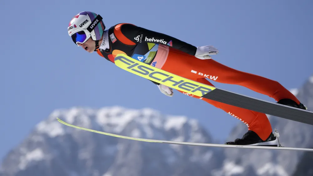 Simon Ammann, of Switzerland, soars through the air during his first round jump in the Men Flying Hill Team competition at the FIS Ski Jumping World Cup in Planica, Slovenia, Saturday, March 26, 2022. (AP Photo/Darko Bandic)