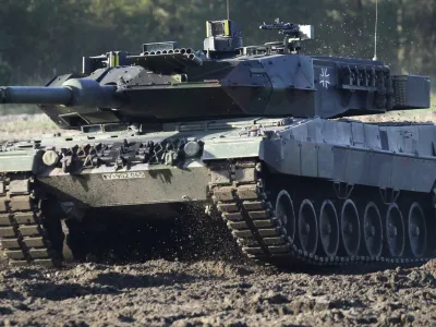 FILE - A Leopard 2 tank is pictured during a demonstration event held for the media by the German Bundeswehr in Munster near Hannover, Germany, Wednesday, Sept. 28, 2011. Chancellor Olaf Scholz is expected to announce Wednesday, Jan. 25, 2023 that his government will approve supplying German-made battle tanks to Ukraine. The long-awaited decision comes after U.S. officials said Tuesday that a preliminary agreement had been struck for the United States to send M1 Abrams tanks to help Kyiv push back Russian forces entrenched in the east almost a year since the start of the war. (AP Photo/Michael Sohn, File)