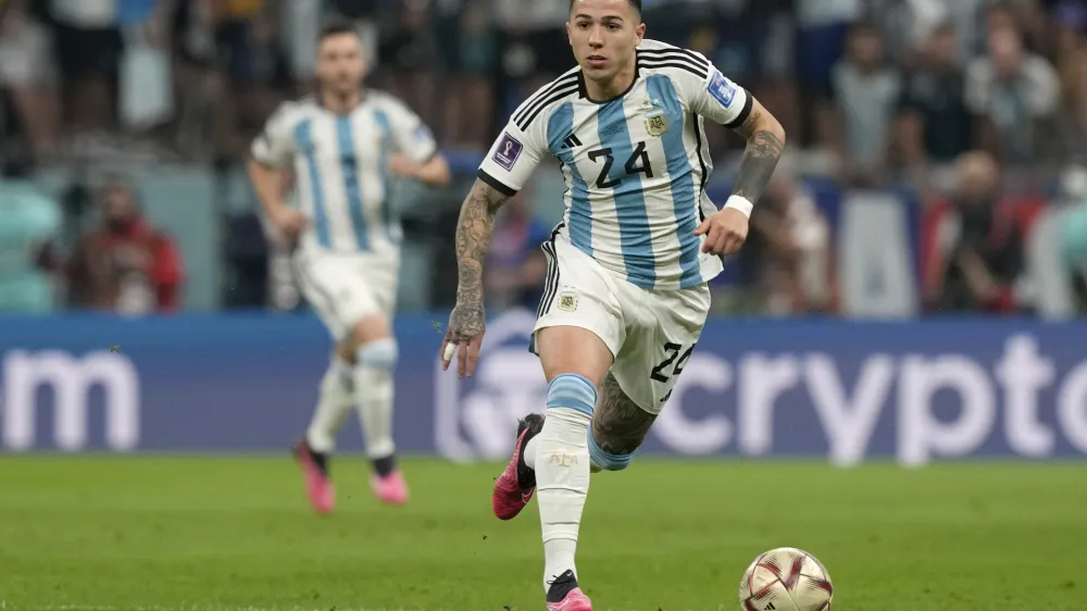 FILE - Argentina's Enzo Fernandez runs with the ball during the World Cup semifinal soccer match between Argentina and Croatia at the Lusail Stadium in Lusail, Qatar, on Dec. 13, 2022. Argentina midfielder Enzo Fernandez became the most expensive player in British soccer history after joining Chelsea from Benfica for 106.7 million pounds ($131.4 million), the Portuguese club announced Wednesday, Feb. 1, 2023. (AP Photo/Frank Augstein, File)