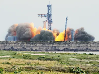 SpaceX ignites 31 out of 33 raptor engines during a Starship booster static fire test Thursday, Feb. 9, 2023, at SpaceX Starbase, Texas launch pad near Boca Chica Beach, Texas. SpaceX is a big step closer to sending its giant Starship spacecraft into orbit, completing an engine-firing test at the launch pad on Thursday.(Miguel Roberts/The Brownsville Herald via AP)