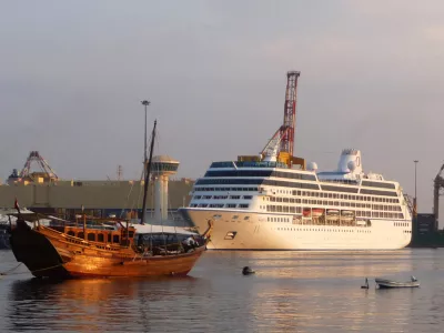 The 600-foot long M/S Nautica, right, prepares for a daylong port stop in the Omani capital of Muscat Wednesday, Dec. 3, 2008. Passengers on a luxury cruise liner attacked by pirates in the dangerous waters between Yemen and Somalia said Wednesday they were surprised by the assailants' boldness and described hearing the "pop, pop, pop" of the pirates' rifles firing at the ship. Sunday's attack on the M/S Nautica in the Gulf of Aden was the latest evidence that pirates have grown more aggressive, viewing almost any ship on the water as a potential target. (AP Photo/ Sebastian Abbot)