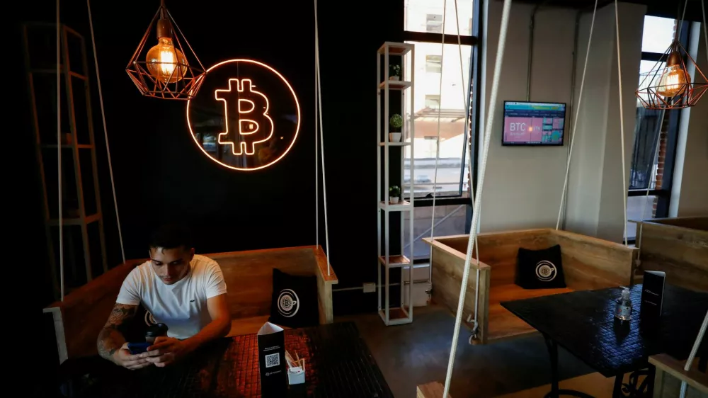 FILE PHOTO: A neon logo of cryptocurrency Bitcoin is seen at the Crypstation cafe, in downtown Buenos Aires, Argentina May 5, 2022. Picture taken May 5, 2022. REUTERS/Agustin Marcarian/File Photo