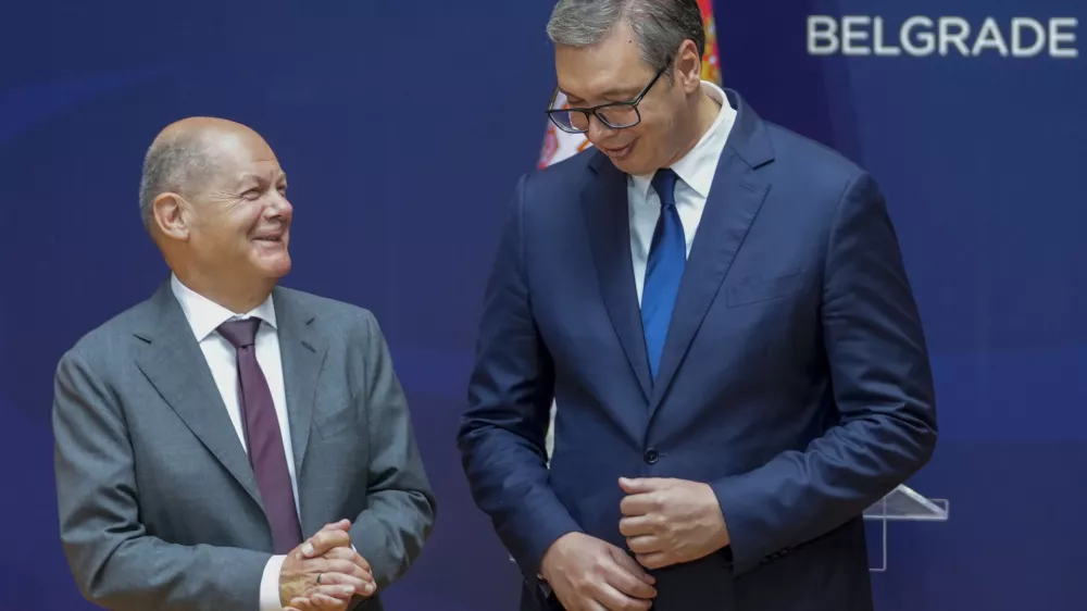 German Chancellor Olaf Scholz, left, and Serbian President Aleksandar Vucic leave after a press conference at the Serbia Palace in Belgrade, Serbia, Friday, July 19, 2024. Scholz visits Serbia to discuss a tentative deal with the Balkan country for the controversial excavation of lithium, a critical substance in making batteries for electric vehicles. (AP Photo/Darko Vojinovic)