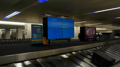 An item of checked luggage is seen near a monitor displaying a blue error screen, also known as the ?Blue Screen of Death? at a baggage claim area inside Terminal C in Newark International Airport, after United Airlines and other airlines grounded flights due to a worldwide tech outage caused by an update to Crowdstrike's "Falcon Sensor" software which crashed Microsoft Windows systems, in Newark, New Jersey, U.S., July 19, 2024. REUTERS/Bing Guan