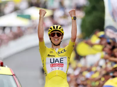 Cycling - Tour de France - Stage 19 - Embrun to Isola 2000 - Embrun, France - July 19, 2024 UAE Team Emirates' Tadej Pogacar celebrates winning stage 19 REUTERS/Manon Cruz