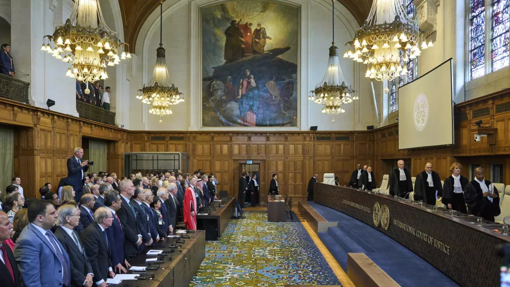 The Judges enter the International Court of Justice, or World Court, in The Hague, Netherlands, Friday July 19, 2024, where the United Nations top court is delivering a nonbinding advisory opinion Friday on the legality of Israel's 57-year occupation of lands sought for a Palestinian state, a ruling that could have more effect on international opinion than it will on Israeli policies. (AP Photo/Phil Nijhuis)