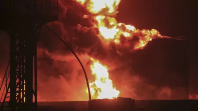 Oil tanks burn at the port in Hodeidah, Yemen, Saturday, July 20, 2024. The Israeli army said it has struck several Houthi targets in western Yemen following a fatal drone attack by the rebel group in Tel Aviv the previous day. (AP Photo)