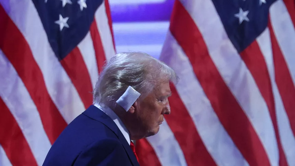 Republican presidential nominee and former U.S. President Donald Trump takes the stage to speak on Day 4 of the Republican National Convention (RNC), at the Fiserv Forum in Milwaukee, Wisconsin, U.S., July 18, 2024. REUTERS/Brian Snyder