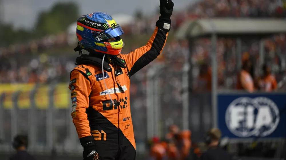 McLaren driver Oscar Piastri of Australia celebrates after winning the Hungarian Formula One Grand Prix race at the Hungaroring racetrack in Mogyorod, Hungary, Sunday, July 21, 2024. (AP Photo/Denes Erdos)