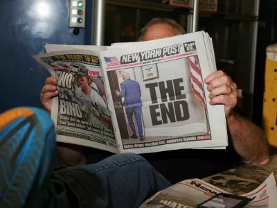 A person reads a copy of the New York Post while taking a break the day U.S. President Joe Biden announced that he is dropping his reelection bid, at the New York Times College Point Printing Plant in Queens, New York City, New York, U.S., July 21, 2024. REUTERS/Caitlin Ochs