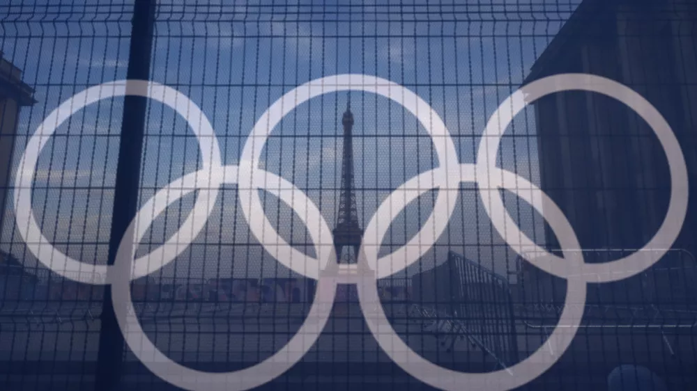 The Eiffel Tower is seen behind the Olympic rings, at the Trocadero plaza Thursday, July 18, 2024 in Paris. (AP Photo/David Goldman)