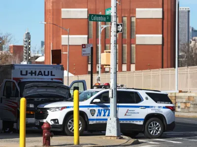 A New York Police Department vehicle blocks a U-Haul rental vehicle, where according to media reports, a man struck multiple people and the NYPD took the driver into custody, near the Battery tunnel in the Brooklyn borough of New York City, U.S., February 13, 2023. REUTERS/Shannon Stapleton