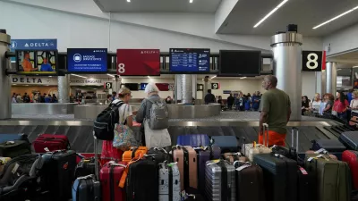 People wait to retrieve their luggage after long delays following cyber outages affecting airlines at Hartsfield-Jackson Atlanta International Airport in Atlanta, Georgia, U.S., July 22, 2024.  REUTERS/Megan Varner