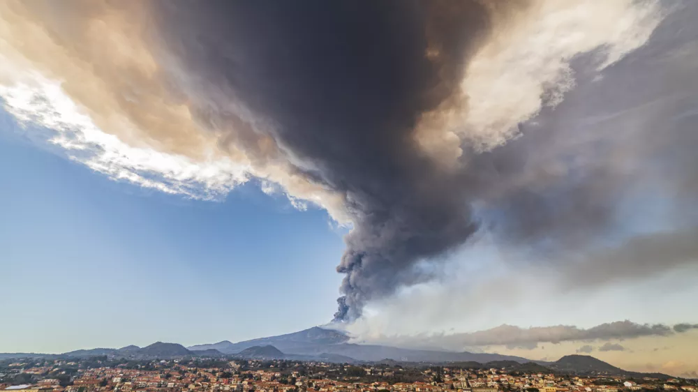 ﻿Volcanic ashes ascend from the southeastern crater of the Mt. Etna volcano as seen from Pedara, Sicily, Italy, Monday, Feb. 21, 2022. The second-strongest paroxysm of 2022 produced volcanic smoke and ashes that rose for 10 kilometers (6.2 miles) forcing the temporary closure of the nearby Vincenzo Bellini international airport in Catania. (AP Photo/Salvatore Allegra)