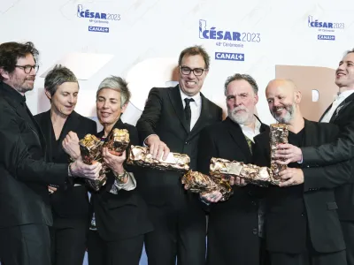 Cast and crew of the movie "La Nuit du 12" pose after receiving six different Cesar awards during the 48th Cesar Award ceremony, in Paris, Friday, Feb. 24, 2023. (AP Photo/Lewis Joly)