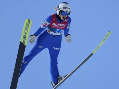 Slovenia's Nika Kriznar competes during the Team Women HS100 competition at the Nordic World Championships in Planica, Slovenia, Saturday, Feb. 25, 2023. (AP Photo/Darko Bandic)