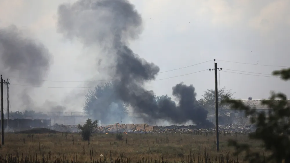 FILE - Smoke rises over the site of explosion at an ammunition storage of the Russian army near the village of Mayskoye, Crimea, Tuesday, Aug. 16, 2022. A spate of drone attacks that Russian authorities blamed on Ukraine has targeted areas in southern and western Russia, reflecting the Ukrainian military's growing reach as the war dragged into a second year. (AP Photo, File)