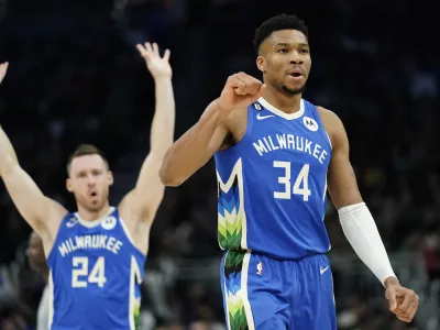 Milwaukee Bucks' Giannis Antetokounmpo (34) and Pat Connaughton (24) celebrate during the second half of the team's NBA basketball game against the Orlando Magic on Wednesday, March 1, 2023, in Milwaukee. (AP Photo/Aaron Gash)