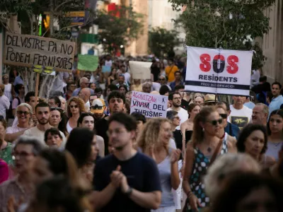 People take part in a protest against mass tourism in Palma de Mallorca, Spain, July 21, 2024. REUTERS/Stringer