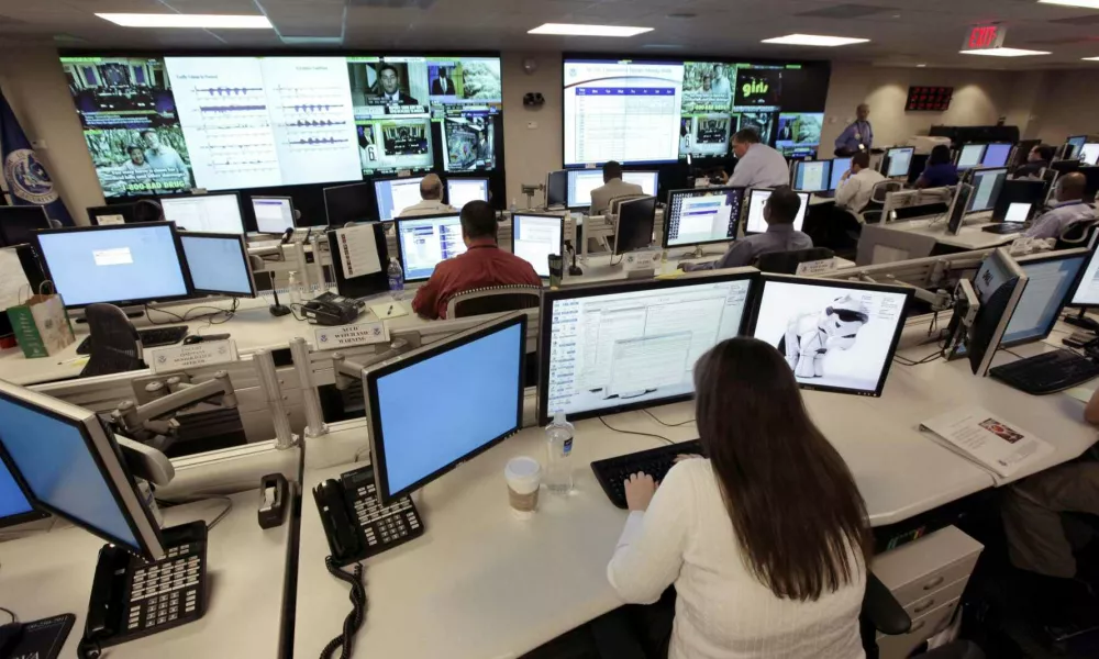 In this Sept. 24, 2010, file photo the National Cybersecurity & Communications Integration Center (NCCIC) prepares for the Cyber Storm III exercise at its operations center in Arlington, Va. It will take several more years for the government to install high-tech systems capable of detecting and blocking computer intrusions, giving hackers more time to figure out how to breach networks and steal sensitive data. The government's computer security weaknesses were laid bare with the WikiLeaks release. (AP Photo/J. Scott Applewhite, File)