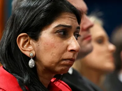 LONDON, ENGLAND - MARCH 07: Home Secretary Suella Braverman listens as Prime Minister Rishi Sunak speaks during a press conference following the launch of new legislation on migrant channel crossings at Downing Street on March 7, 2023 in London, United Kingdom. The new plan will ban refugees arriving in the UK by small boats from today from claiming asylum. Home Secretary Suella Braverman has said the new legislation "pushes the boundaries of international law". Leon Neal/Pool via REUTERS