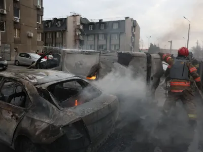 Emergency workers extinguish fire in vehicles at the site of a Russian missile strike, amid Russia?s attack on Ukraine, in Kyiv, Ukraine March 9, 2023. REUTERS/Gleb Garanich