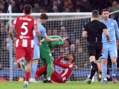 Soccer Football - Champions League - Quarter-Final - First Leg - Manchester City v Atletico Madrid - Etihad Stadium, Manchester, Britain - April 5, 2022 Atletico Madrid's Matheus Cunha clashes with Manchester City's Ederson REUTERS/Phil Noble