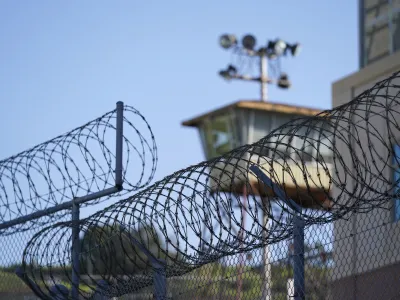 Razor wire is seen below a guard tower at San Quentin State Prison in San Quentin, Calif., Friday, March 17, 2023. Gov. Gavin Newsom plans to transform San Quentin State Prison, a facility in the San Francisco Bay Area known for maintaining the highest number of prisoners on death row in the country. Newsom said his goal is to turn the prison into a place where inmates can be rehabilitated and receive job training before returning to society. (AP Photo/Eric Risberg)