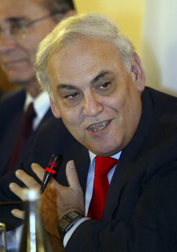 ** FILE ** Former U.S. Pentagon adviser Richard Perle gestures during a news conference in this Oct. 14, 2003, file photo in Jerusalem. Perle, a leading proponent of the U.S.-led invasion of Iraq, now says devastating dysfunction within the Bush administration has turned U.S. policy there into a disaster. (AP Photo/Lefteris Pitarakis, file)