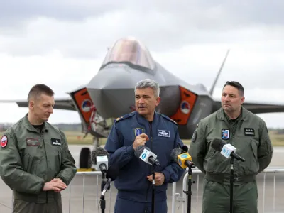 Brigadier General Ireneusz Nowak and Brigadier General Omer Nafiz Gulmezoglu speak to the media during a NATO media event at an airbase in Malbork, Poland, March 21, 2023. REUTERS/Lukasz Glowala