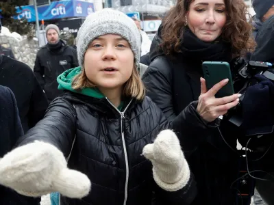 FILE PHOTO: Climate activist Greta Thunberg gestures as she walks outside during the World Economic Forum in Davos (WEF) in Davos, Switzerland January 19, 2023. REUTERS/Arnd Wiegmann/File Photo