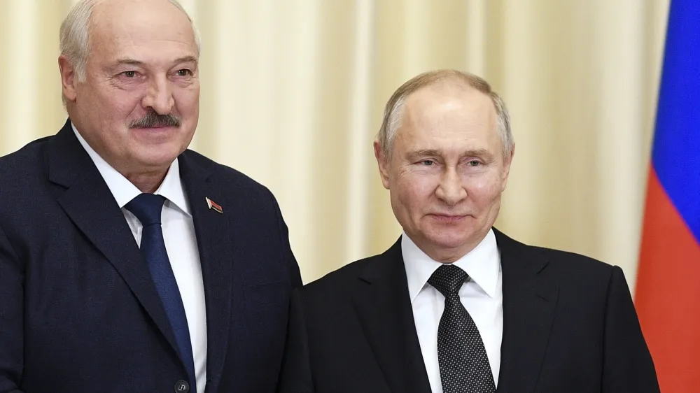 FILE - Russian President Vladimir Putin, right, and Belarusian President Alexander Lukashenko pose for a photo prior to their talks at the Novo-Ogaryovo state residence, outside Moscow, Russia, Feb. 17, 2023. Russian President Vladimir Putin has announced that he intends to deploy tactical nuclear weapons on the territory of Belarus. The move appears to be another attempt by Putin to raise the stakes in the conflict in Ukraine. (Vladimir Astapkovich, Sputnik, Kremlin Pool Photo via AP, File)