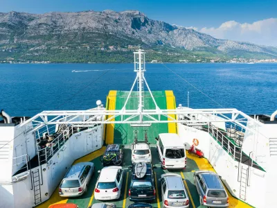 FB8T56 Cars on the ferry from the mainland Peljesac Peninsula to the Island of Korcula, Croatia, Europe.