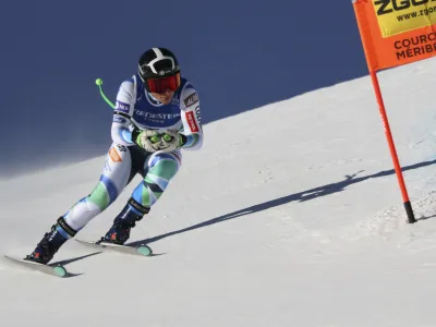 Slovenia's Ilka Stuhec speeds down the course during an alpine ski, women's World Championships downhill training, in Meribel, France, Friday, Feb. 10, 2023. (AP Photo/Marco Trovati)