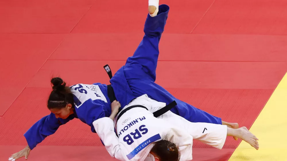 Paris 2024 Olympics - Judo - Women -48 kg Elimination Round of 32 - Champ de Mars Arena, Paris, France - July 27, 2024. Milica Nikolic of Serbia in action against Stangar Marusa of Slovenia REUTERS/Kim Kyung-Hoon