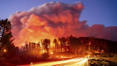 Seen in a long exposure photograph, the Park Fire burns along Highway 32 in the Forest Ranch community of Butte County, Calif., on Thursday, July 25, 2024. (AP Photo/Noah Berger)