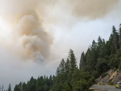 A column of smoke from the Park Fire rises over Highway 32 near Forest Ranch, Calif., Saturday, July 27, 2024. (AP Photo/Nic Coury)