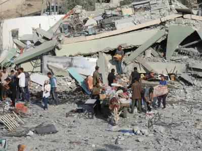 Palestinians inspect a destroyed mosque, following an Israeli strike, amid Israel-Hamas conflict, in Deir Al-Balah, in the central Gaza Strip, July 27, 2024. REUTERS/Ramadan Abed