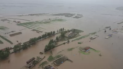 This undated photo provided on Monday, July 29, 2024 by the North Korean government, shows a flood-hit area in North Phyongan province, North Korea. Independent journalists were not given access to cover the event depicted in this image distributed by the North Korean government. The content of this image is as provided and cannot be independently verified. Korean language watermark on image as provided by source reads: "KCNA" which is the abbreviation for Korean Central News Agency. (Korean Central News Agency/Korea News Service via AP)