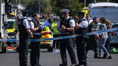 29 July 2024, United Kingdom, Southport: Police work in Southport, Merseyside, where a man has been detained and a knife has been seized after a number of people were injured in a reported stabbing. Eight patients with stab injuries have been treated at the scene and taken to hospitals including Alder Hey Children's Hospital. Photo: James Speakman/PA Wire/dpa