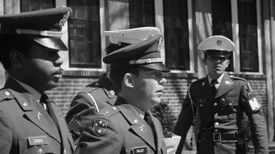 Lt. William Calley is escorted to the Fort Benning stockade to begin his lifeterm in prison for his part in the My Lai massacre during the Vietnam War. Calley's sentence was later reduced and he was released on parole in November 1975. March 31, 1971 Fort Benning, Georgia, USA