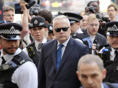 Former BBC broadcaster Huw Edwards arrives at Westminster Magistrates' Court in London, Wednesday July 31, 2024 where he is charged with three counts of making indecent images of children following a Metropolitan Police investigation. (Jonathan Brady/PA via AP)