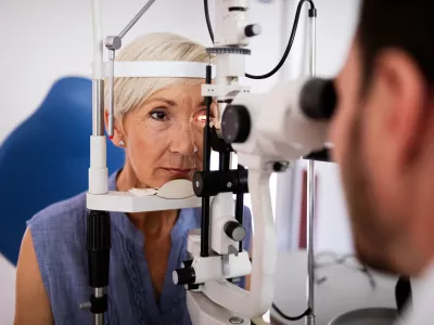 Ophthalmology concept. Senior woman eye vision examination in ophthalmological clinic