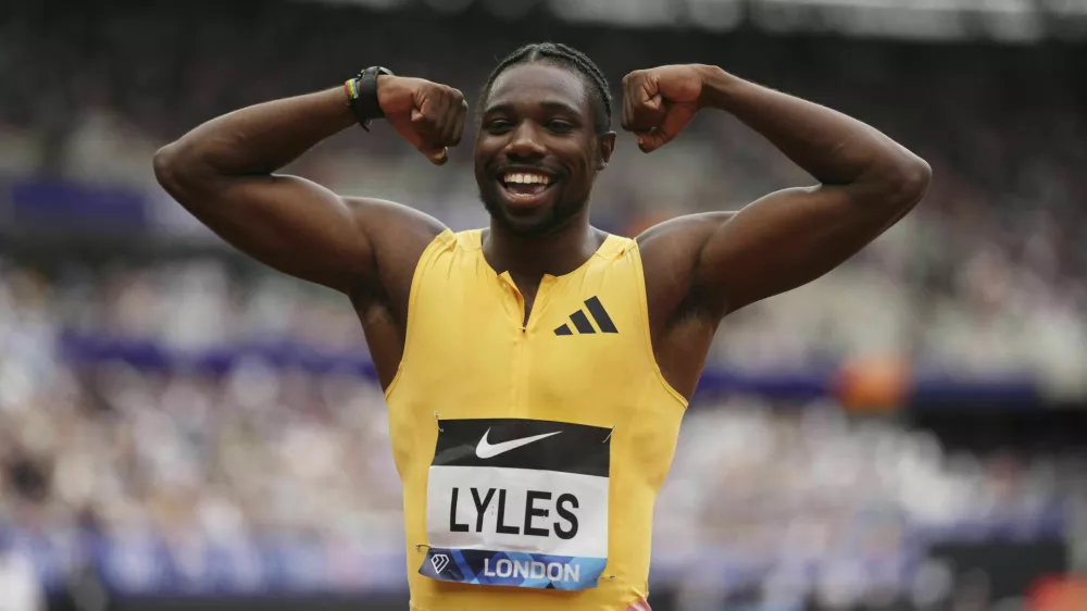 Winner Noah Lyles celebrates after the Men's 100m final during during the Diamond League London Athletics Meet in London, England, Saturday, July 20, 2024. (John Walton/PA via AP)