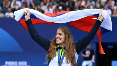 Paris 2024 Olympics - Champions Park medallists celebrations - Champions Park, Paris, France - July 31, 2024. Judo women -63 kg gold medallist Andreja Leski of Slovenia celebrates with her medal and the flag of Slovenia during the Champions Park medallists celebrations REUTERS/Annegret Hilse