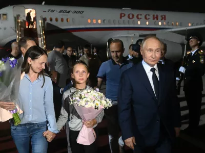 epa11517344 Russian President Vladimir Putin (R) meets Russian citizens released after the Russian-US prisoner swap in Turkiye at Vnukovo International Airport in Moscow, Russia, 01 August 2024. On August 01, Ankara hosted the Russian-US exchange of 26 individuals held in prisons in the United States, Germany, Poland, Slovenia, Norway, Russia, and Belarus. Ten of the prisoners exchanged, including two minors, went to Russia, 13 to Germany, and three to the US. Those returned to Russia include Artem and Anna Dultsev with their children, Vadim Krasikov, Pavel Rubtsov, Mikhail Mikushin, Roman Seleznev, Vladislav Klyushin, and Vadim Konoshchenok. EPA/MIKHAIL VOSKRESENSKIY/SPUTNIK/KREMLIN POOL MANDATORY CREDIT EPA-EFE/MIKHAIL VOSKRESENSKIY/SPUTNIK/KREMLIN POOL MANDATORY CREDIT